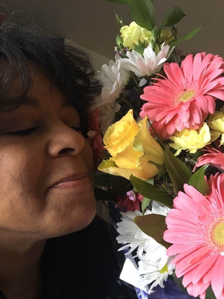 kai smelling flowers